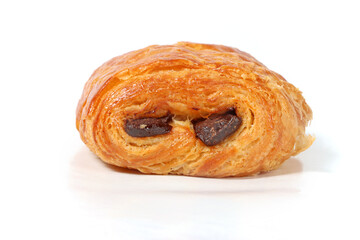 Freshly baked pain au chocolat, golden and flaky pastry with visible layers, isolated on a white background
