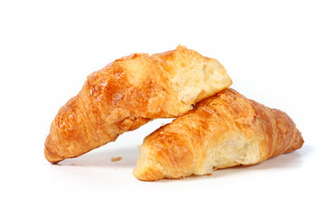 Golden, flaky butter croissant with crispy layers, isolated on a white background