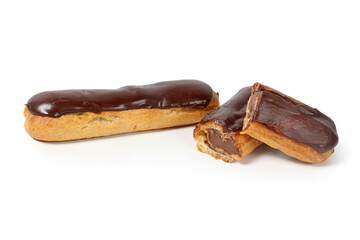 Chocolate éclair on a white background, showcasing its glossy chocolate glaze and delicate choux pastry filled with cream. A classic French dessert