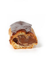 Chocolate éclair on a white background, showcasing its glossy chocolate glaze and delicate choux pastry filled with cream. A classic French dessert