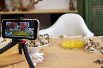 a view through the phone camera of the Easter wreath making workshop