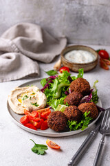 Salad with hummus, falafel and vegetables