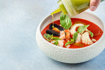 tomato soup with seafood, cold tomato soup or gazpacho, top view. copy space for text