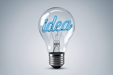 Glass lightbulb with blue neon "idea" inside, showcasing creativity and innovation concept