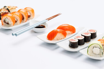 Assorted sushi and maki rolls beautifully arranged on plates