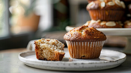Cherry almond muffin halved to reveal moist interior, nutty fruit combo ideal for gourmet bakery branding and healthy snack visuals