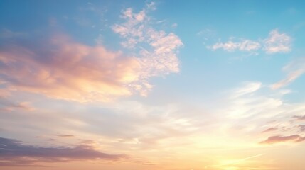 Obraz premium A beautiful sky filled with soft clouds and a gradient of colors during sunset, creating a serene and tranquil atmosphere.