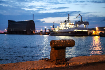 A large ship is docked at a pier in Hirtshals Denmark