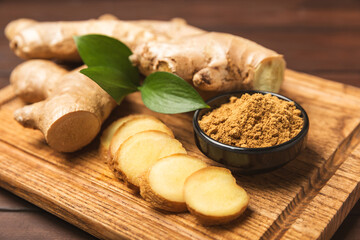 Fresh ginger on wooden background. Dry ginger. Sliced ​​ginger with honey and lemon. Ginger...
