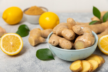 Fresh ginger on wooden background. Dry ginger. Sliced ​​ginger with honey and lemon. Ginger...