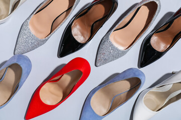 High heeled shoes on light background, flat lay