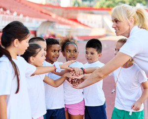 child sport athlete competition support motivation together coach teamwork holding hands success achievement celebration unity exercise kid fitness training