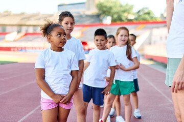 child sport athlete childhood girl competition fun young outdoor active exercise kid running fitness training athletic game healthy group play team school exercising