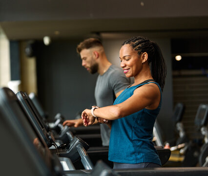 gym sport fitness exercise health healthy woman treadmill training watch technology smart app using device time pulse checking monitor running equipment workout athlete jogging