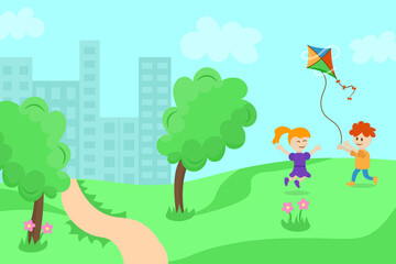 Children playing with a kite in a meadow outside the city