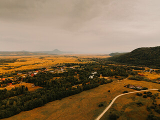 A breathtaking aerial shot spectacularly showcasing a vast landscape filled with hills and valleys...