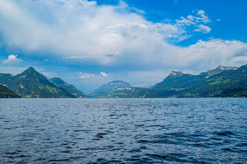 Lake in the Swiss Alps. Panoramic view of the nature and mountains of Switzerland. Mountain in the in summer, panoramic view with mountain. Alpine scenery. Mountains over the lake and the alps.