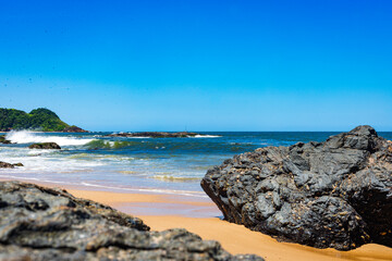 Ocean Harmony: Rocky Shoreline and Verdant Landscape 
