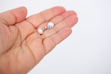 Hand holding pearl stud earrings, jewelry set, elegance pearl accessories, delicate beauty, Elegant...