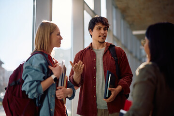 Group of college students communicating after lecture.