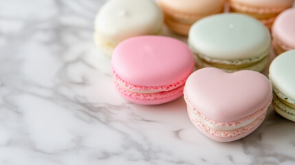 Obraz premium Pink and white heart-shaped macarons with red heart decorations scattered around them. 