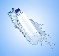 Bottle of water and splashes in air on light blue background