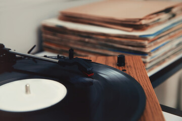 Turntable with vinyl record in room, closeup