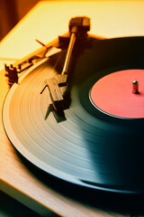 Turntable with vinyl record, closeup. Color toned