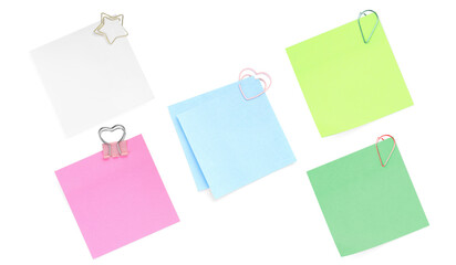 Blank notes with paper clips isolated on white, set. Top view