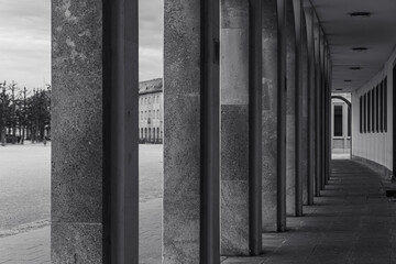 Architectural details of a concrete corridor in a historical building during early afternoon