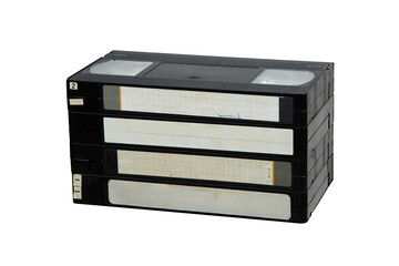 A set of four vintage VHS cassettes with blank labels, classic black plastic design, evoking...
