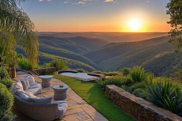 Aerial view of a stylish patio featuring a cozy couch and a table, offering a scenic overlook of a beautiful valley landscape.
