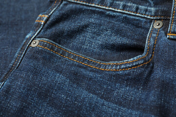 Fototapeta premium Stylish dark blue jeans with pocket as background, closeup