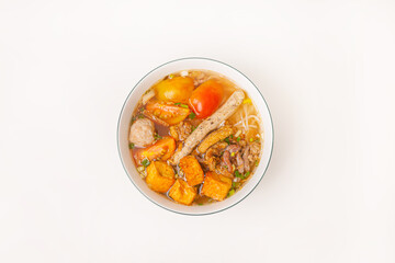 Bun Rieu Cua, Crab paste vermicelli soup with minced shrimp, tofu, tomato, shrimp paste, Vietnamese food isolated on white background, close up