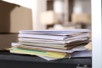 Many different envelopes on shelf in post office