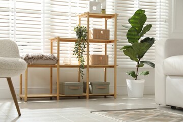 Stylish shelving unit with decor in room
