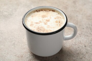 Aromatic Masala tea in cup on grey table, closeup
