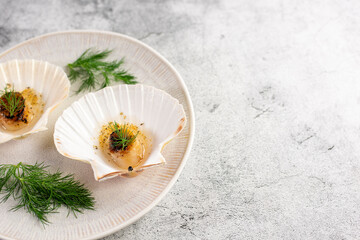 Grilled scallops with butter, quinoa pop, garlic, lime