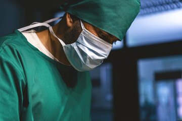 male caucasian doctor working emergency room. specialist surgical man determined doing surgery help...