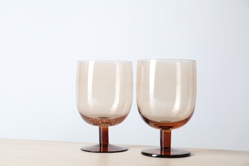 Two empty clean glasses on wooden table