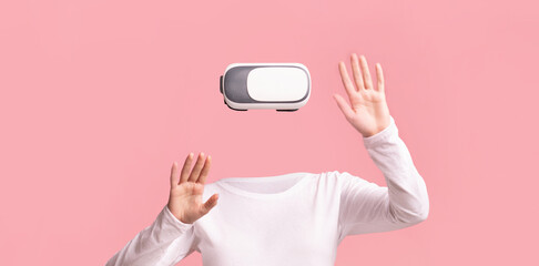 A user wearing a virtual reality headset interacts with an immersive environment. The person is...