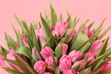 Fototapeta premium Bouquet of beautiful tulips on pink background, closeup