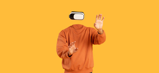 A person wearing modern virtual reality goggles engages with an immersive digital experience. The individual appears headless against a bright yellow background, showcasing innovative tech.