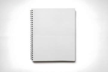 White spiral notebook with blank cover on white background