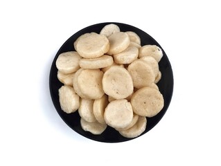 Kerupuk ikan or fish cracker on plate isolated on white background, Indonesian typical traditional food 