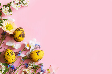 Easter flat lay. Stylish easter eggs and spring flowers on pink background, space for text. Easter modern minimal banner. Season greetings mockup