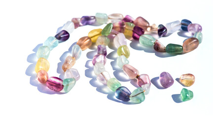 Fluorite natural colorful stones, mineral, beads of bracelet, necklace isolated on white background. Fluorspar stone gems, set of natural mineral stones, beautiful gemstones. 