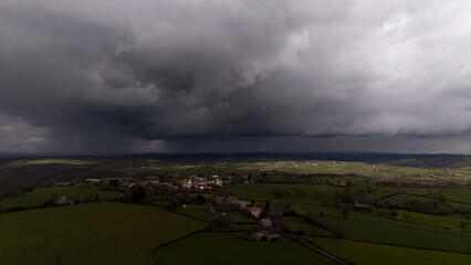 French village centres under rain clouds