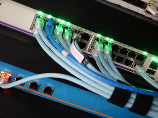 Network Switch with Fiber Cables Connected and Lighting Indicators