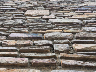 Textured Stone Wall with Varying Colors and Patterns
